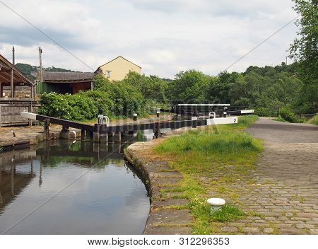 Wooden Lock Gates On The Calder Hand Hebble Navigation Canal In Front Of The Basin In Sowerby Bridge