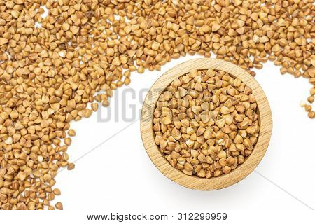 Lot Of Whole Raw Brown Buckwheat Grain In A Wooden Bowl Flatlay Isolated On White Background