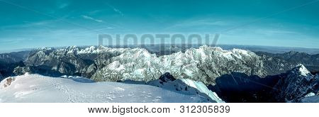Panoramic View To The North From The Mountain Hut Kredarica. Winter In Julian Alps, Slovenia, Europe