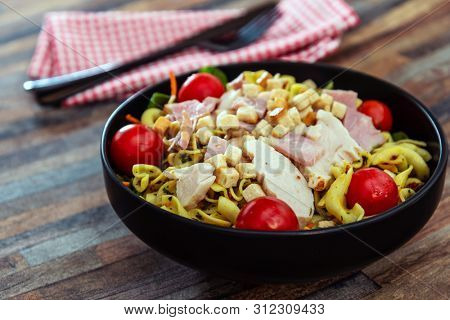 cereal specialties cooked with salad, roasted chicken aiguillette cured with salted and bacon