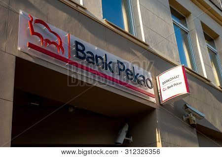 Poznan, Poland - August 12, 2018: The Logo Above An Entrance To Polish Bank Pekao With Atm (bankomat