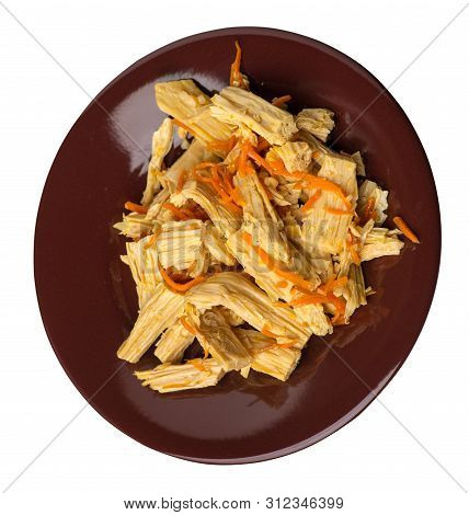 Soy Asparagus And Carrot Salad On A Brown  Plate. Soy Asparagus Isolated On White Background. Asian 