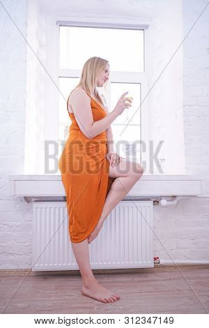 Pretty Plus Size Caucasian Woman Drink Wine In The Morning Alone At Home