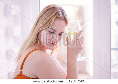 Pretty Plus Size Caucasian Woman Drink Wine In The Morning Alone At Home