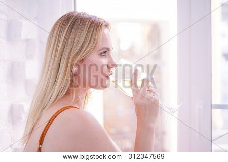 Pretty Plus Size Caucasian Woman Drink Wine In The Morning Alone At Home