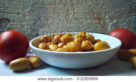 Fresh And Healthy Barhi Dates With Tomato