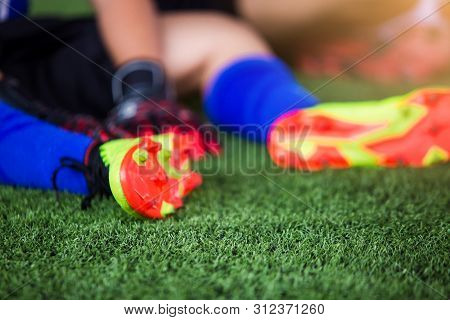 Selective Focus To Goalkeeper Is Sitting And Catch The Soles Of The Feet Because Of Pain, Soccer Pla