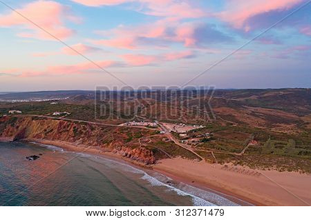 Aerial from Praia do Amado at the west coast in Portugal at sunset