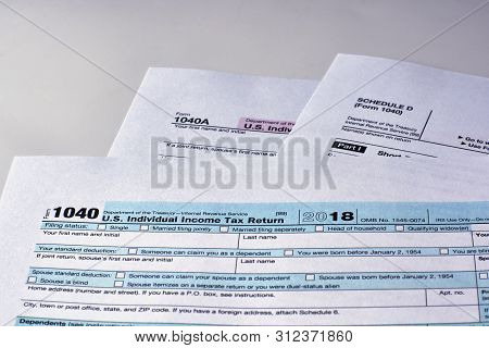 Tax Form 1040, Schedule D, 1040a On A White Background