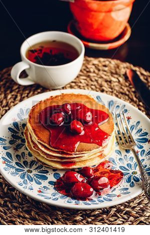 Stack Of Pancakes With Dogberry Jam On White Plate With Ornate