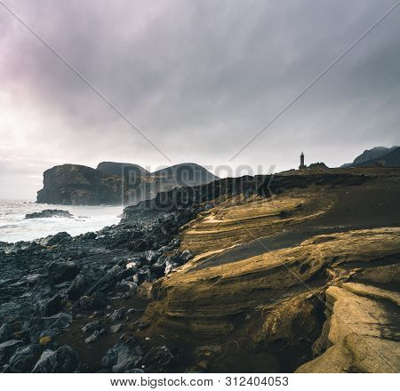 View Over Capelinhos Volcano, Lighthouse Of Ponta Dos Capelinhos On Western Coast On Faial Island, A
