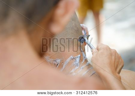 Closeup Shot Of Shaved Hair For Ordained Buddhist Man. Ordain Into Monkhood, Thailand