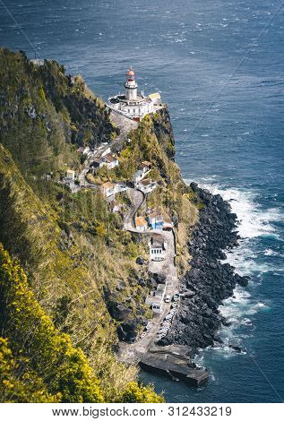 Dramatic View Down To Lighthouse On Ponta Do Arnel, Nordeste, Sao Miguel Island, Azores, Portugal