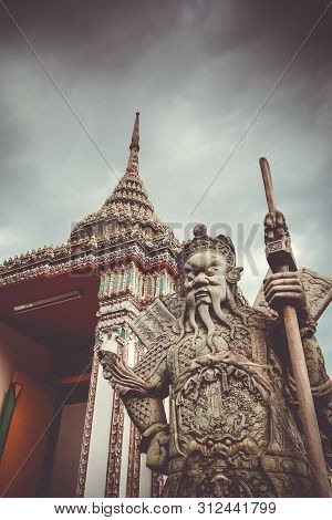 Chinese Guard Statue In Wat Pho Buddhist Temple, Bangkok, Thailand