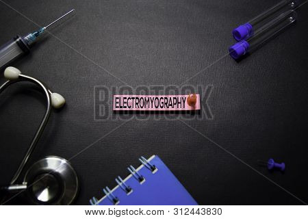 Electromyography Text On Sticky Notes. Top View Isolated On Black Background. Healthcare/medical Con