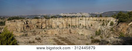 A Desrted Quary Near Jerusalem, Israel. Nature Slowly Reclaims The Place, Pine Trees And Vegetation 