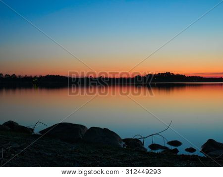 Beautiful Lake Shore In Bemidji, Minnesota In Spring Just After Sunset.