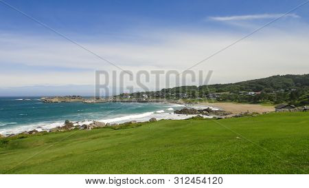 Tanesashi Kaigan Coast. The Coastline Includes Both Sandy And Rocky Beaches, And Grassy Meadows Scen