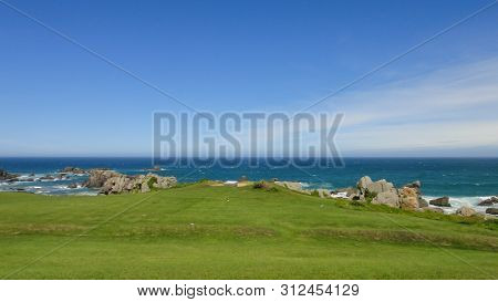 Tanesashi Kaigan Coast. The Coastline Includes Both Sandy And Rocky Beaches, And Grassy Meadows Scen