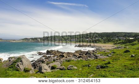 Tanesashi Kaigan Coast. The Coastline Includes Both Sandy And Rocky Beaches, And Grassy Meadows Scen