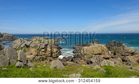 Tanesashi Kaigan Coast. The Coastline Includes Both Sandy And Rocky Beaches, And Grassy Meadows Scen