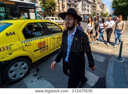 Bucharest, Romania - June 25, 2019: A Member Of Chabad Lyubavitsh Of Romania (chabad-lubavitch) Walk