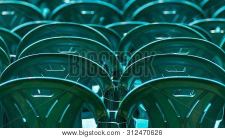 Bucharest, Romania - June 23, 2019: Green Plastic Chairs Are Placed In Izvor Park For Spectators Who