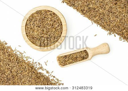 Lot Of Whole Dry Caraway Fruits Small Crescent In A Wooden Bowl With Wooden Scoop Flatlay Isolated O