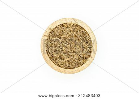 Lot Of Whole Dry Caraway Fruits Closeup In A Wooden Bowl Flatlay Isolated On White Background