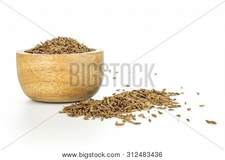 Lot Of Whole Small Dry Caraway Fruits In A Wooden Bowl Isolated On White Background