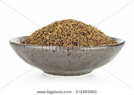 Lot Of Whole Dry Caraway Fruits In A Grey Ceramic Bowl Isolated On White Background