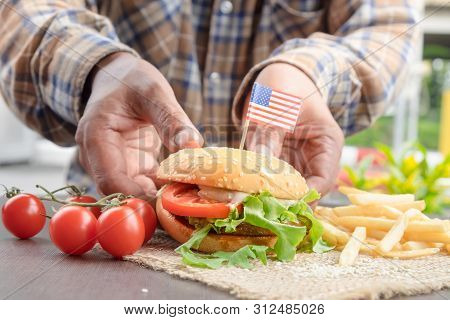 The Homemade Hamburger With Fresh Vegetables, French Fries, Beef, Onion, Tomato, Lettuce, Cheese And