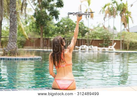 A Woman Launches A Drone For Flight, With Which You Can Take Photos And Video Filming