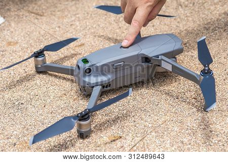 Male Hand Presses The Button To Launch The Drone For Flight, Close-up