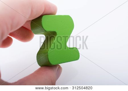 Hand Holding Letter Cube Z Of Made Of Wood