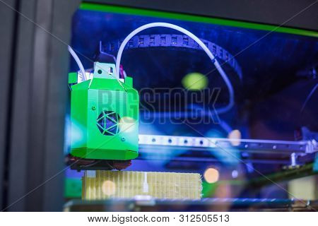 Print Head Of 3d Printer Machine Printing Plastic Model At Modern Scifi Technology Exhibition. 3d Pr