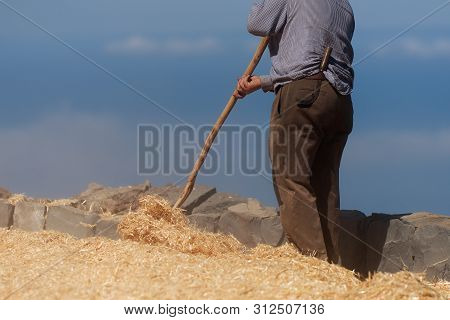 The Farmer Fanning Wheat Separating The Wheat From The Chaff
