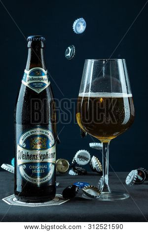 Khabarovsk, Russia - Jul 21, 2018: Beer Bottle Weihenstephan And A Glass Of Beer On Table On Blue Ba