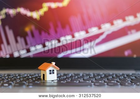 Growing Home Sale Grap. Model Of The House On The Background Of Growth Graph. The Concept Of Rising 