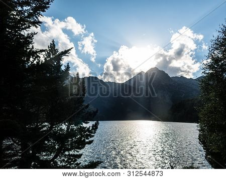 The Last Rays Of Sun On The Pond Of Sant Maurici, In The Aiguestortes And Sant Maurici National Park