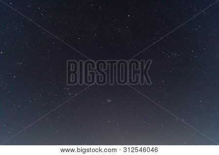 Underexposed Night Sky Low Light Photo. A Lot Of Stars And Constellations On Dark Sky. Stock Photo O