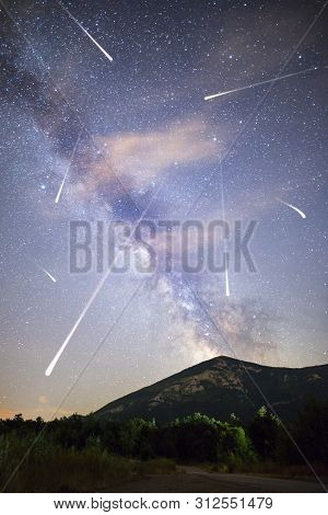A View Of A Meteor Shower And The Milky Way With A Mountain Top In The Foreground. Night Sky Nature 