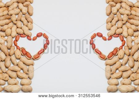 Peanuts, For Background Or Textures. Uncleaned Inshell Peanuts. Peanuts Isolated On White Background