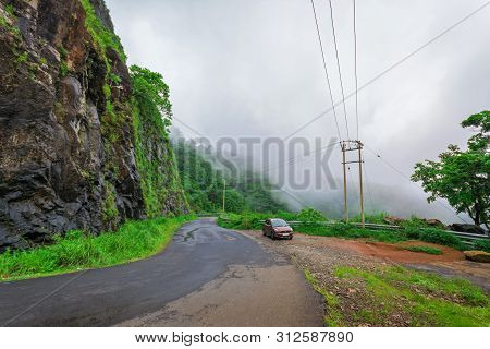 Vehicles Moving Towards The Hills Station Area At Vagamon