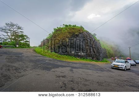 Vehicles Moving Towards The Hills Station Area At Vagamon