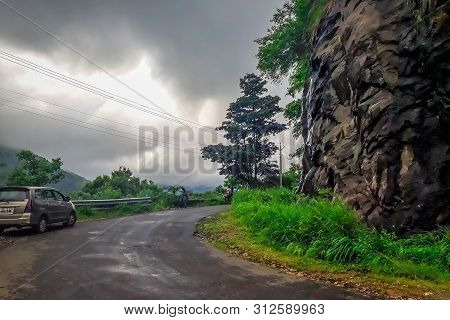 Vehicles Moving Towards The Hills Station Area At Vagamon