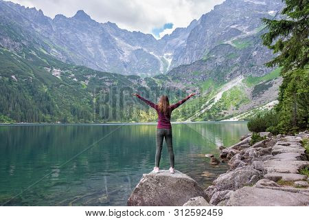 Young Tourist Girl On Lake Morskie Oko (sea Eye), Zakopane, Poland, High Tatras