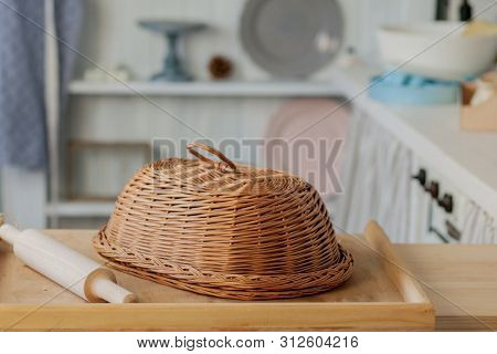 Wicker Breadbasket On Kitchen Table At The Photo Studio