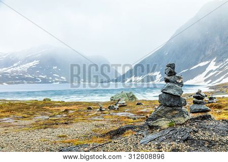 Stone Cairns At The Djupvatnet Lake Geiranger, Sunnmore Region, More Og Romsdal County, Norway