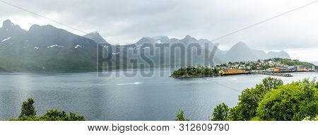 Husoy Island Village Panorama With Mountains In The Background, Senja Island, Troms County, Norway
